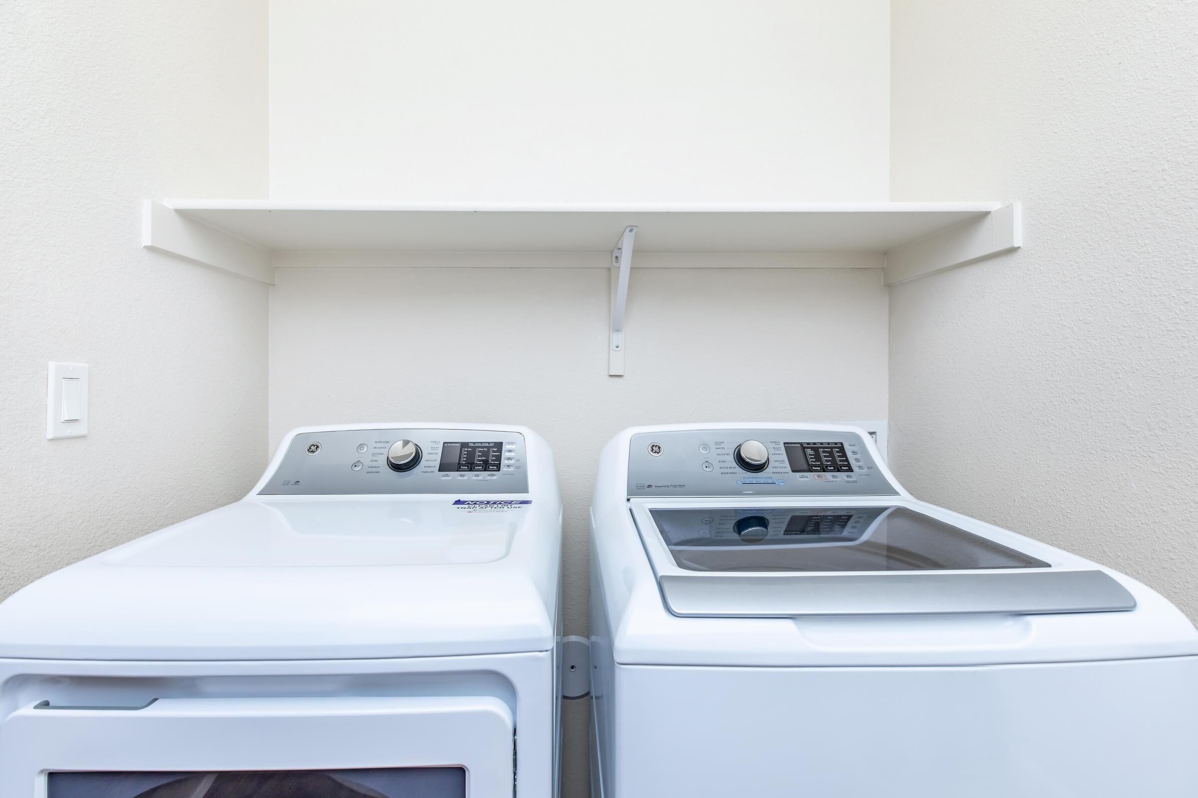 a stove top oven sitting inside of a kitchen