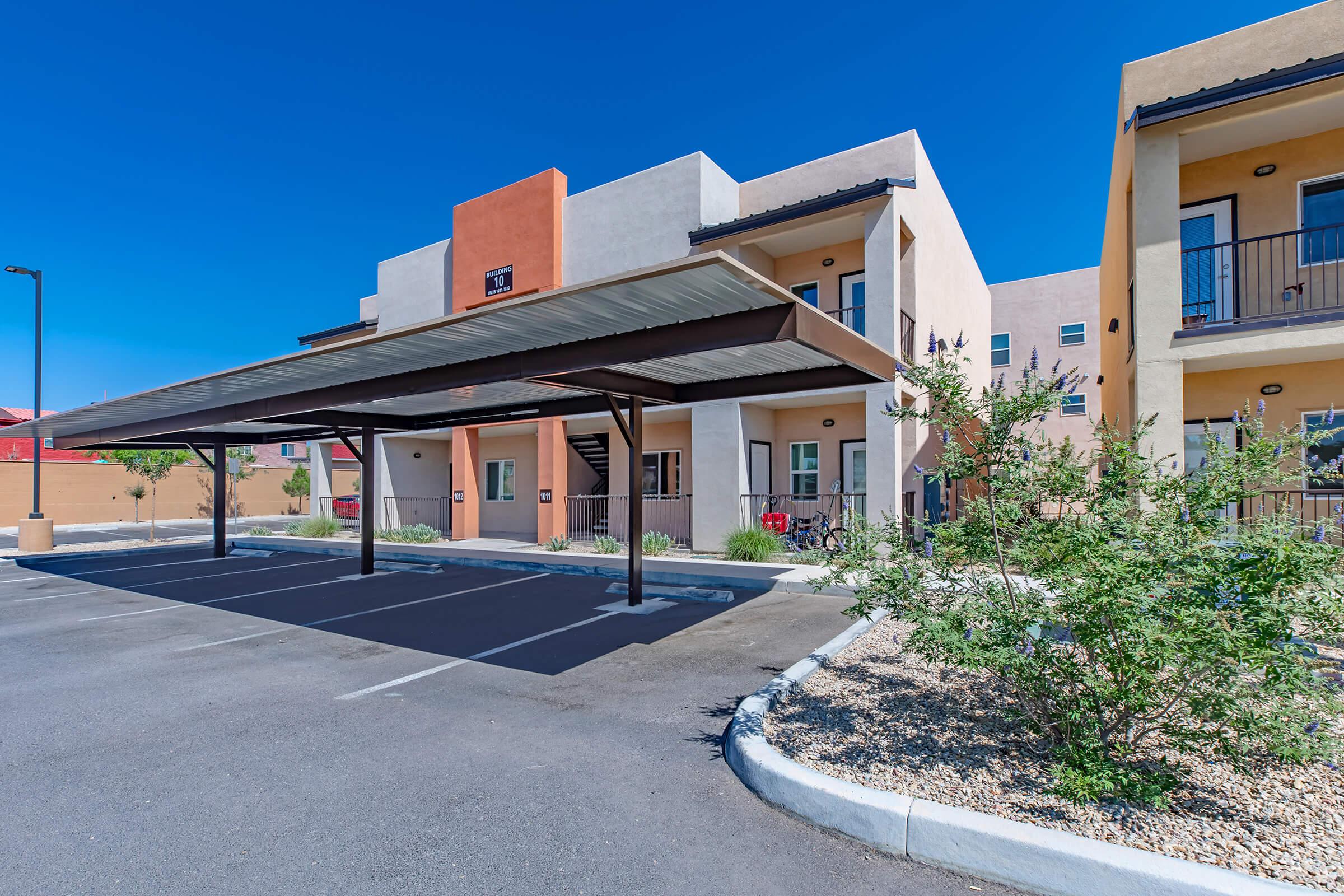 an empty parking lot in front of a building