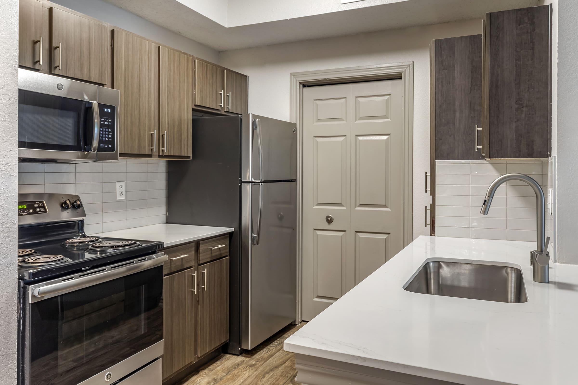 a modern kitchen with stainless steel appliances