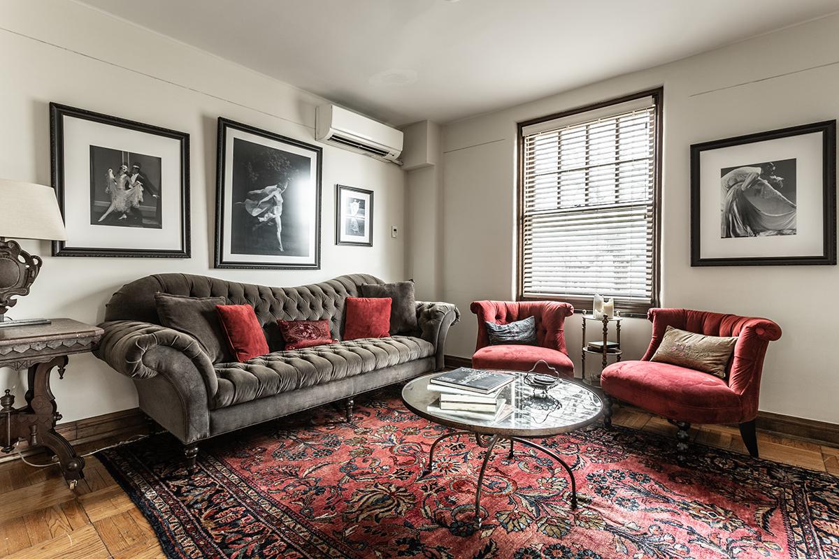 a living room filled with furniture and a flat screen tv