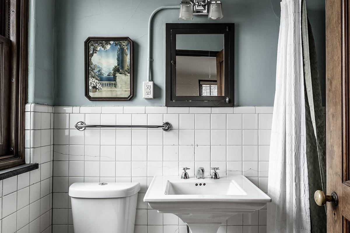 a restroom with a sink and a mirror