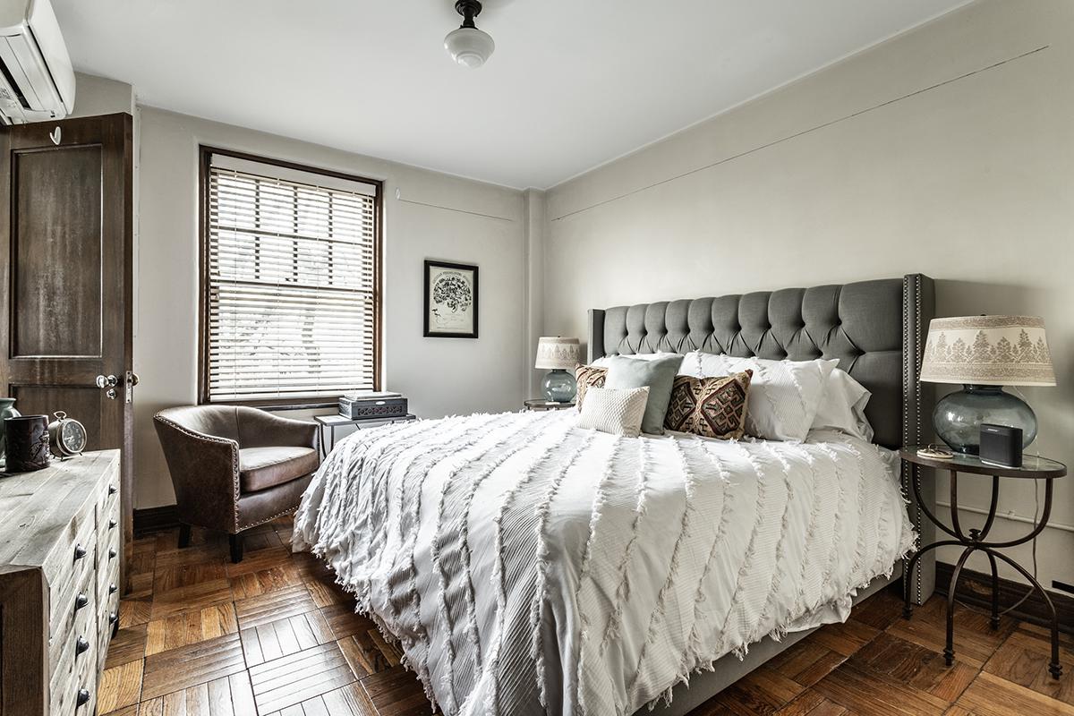 a bedroom with a large bed in a hotel room