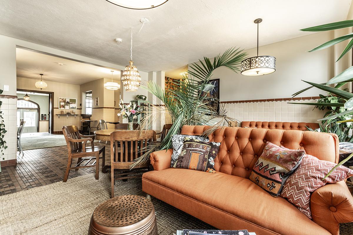 a living room filled with furniture and a table