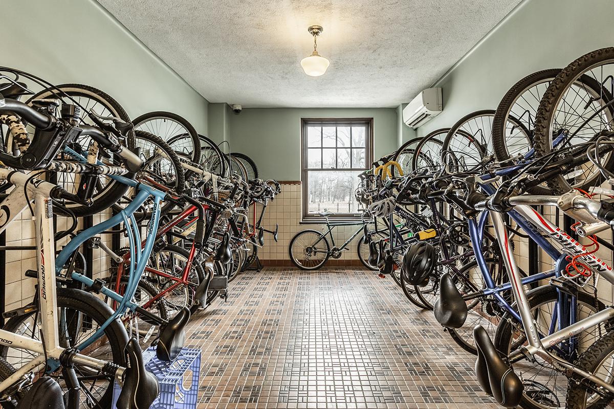 a bicycle leaning against a wall
