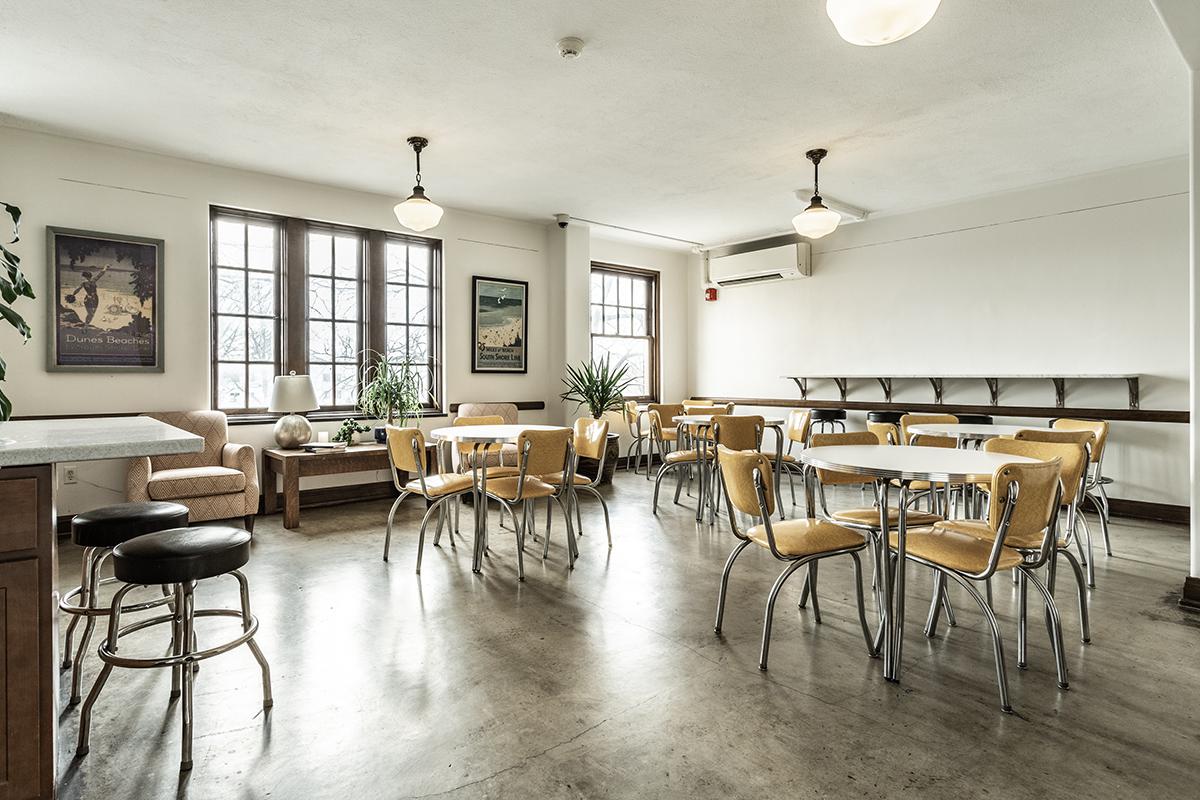 a living room filled with furniture and a table