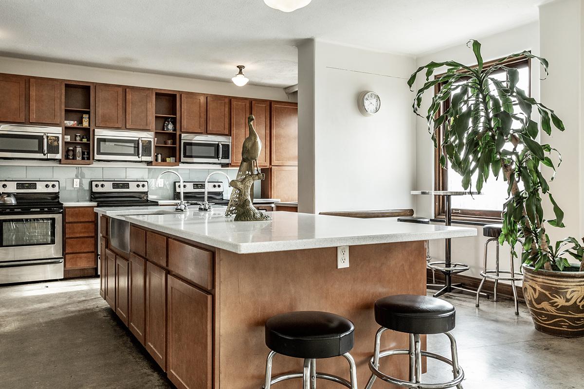 a kitchen with an island in the middle of a room