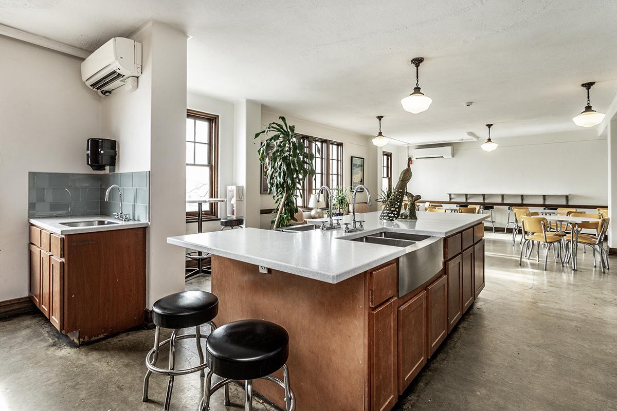 a kitchen with a table in a room