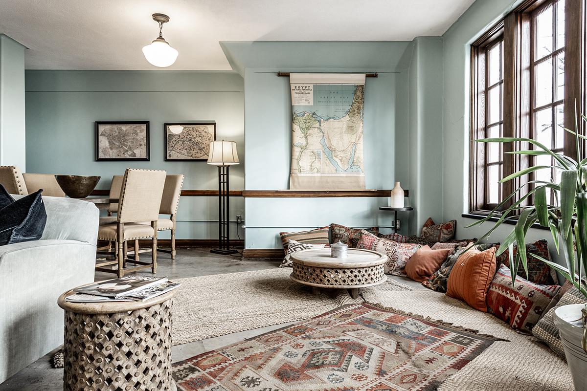 a living room filled with furniture and a fire place