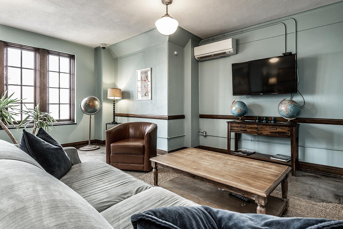 a hotel room with a bed and a window