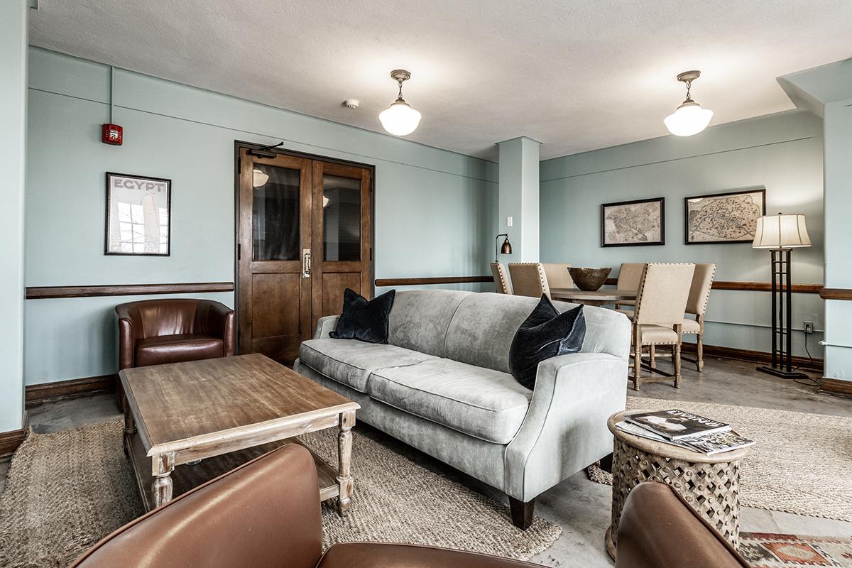 a living room filled with furniture and a flat screen tv