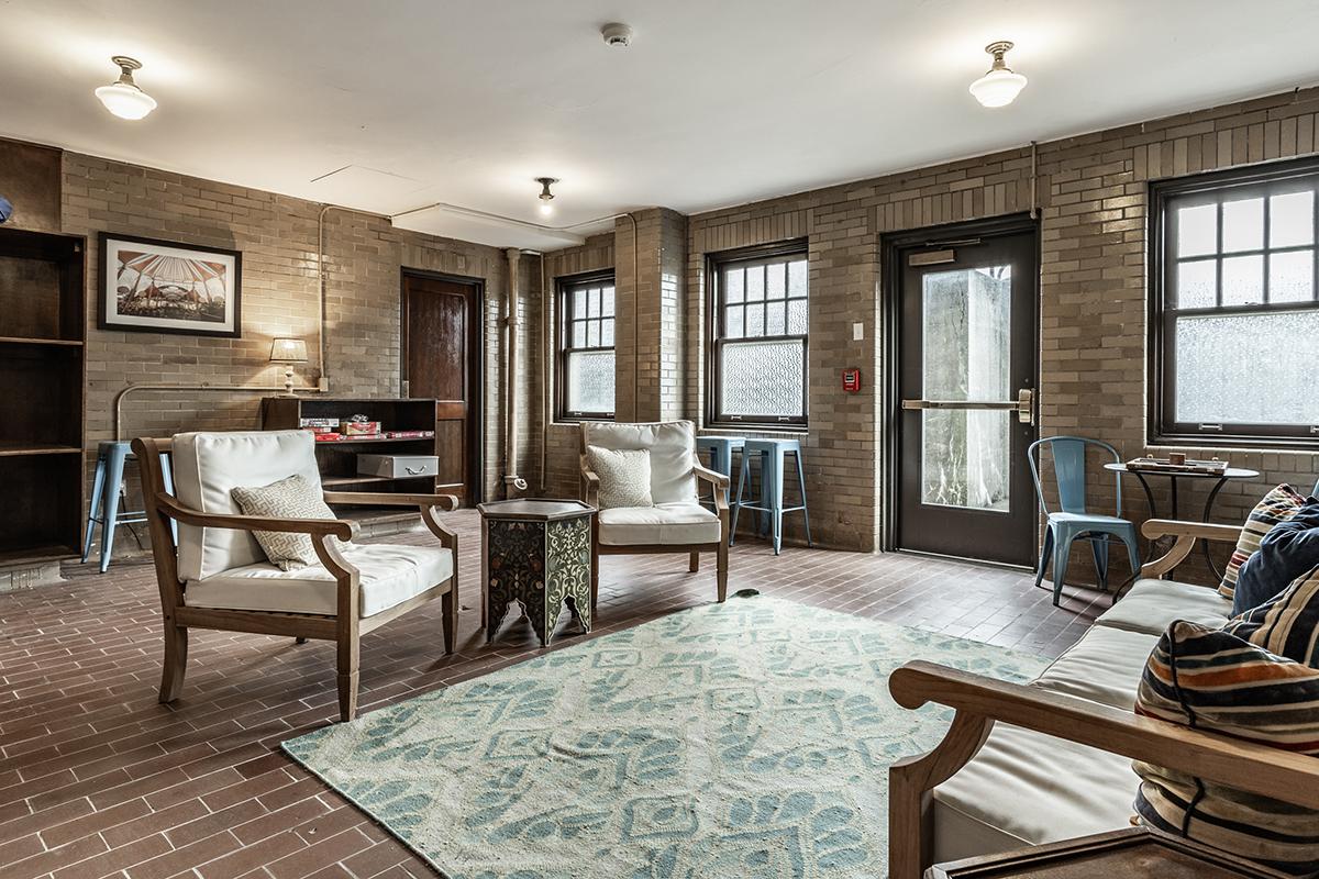 a living room filled with furniture and a large window