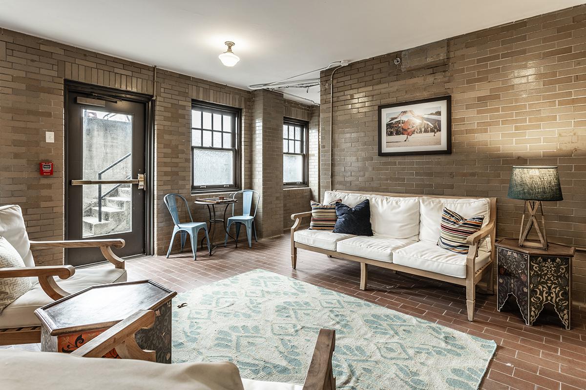 a living room filled with furniture and a fireplace