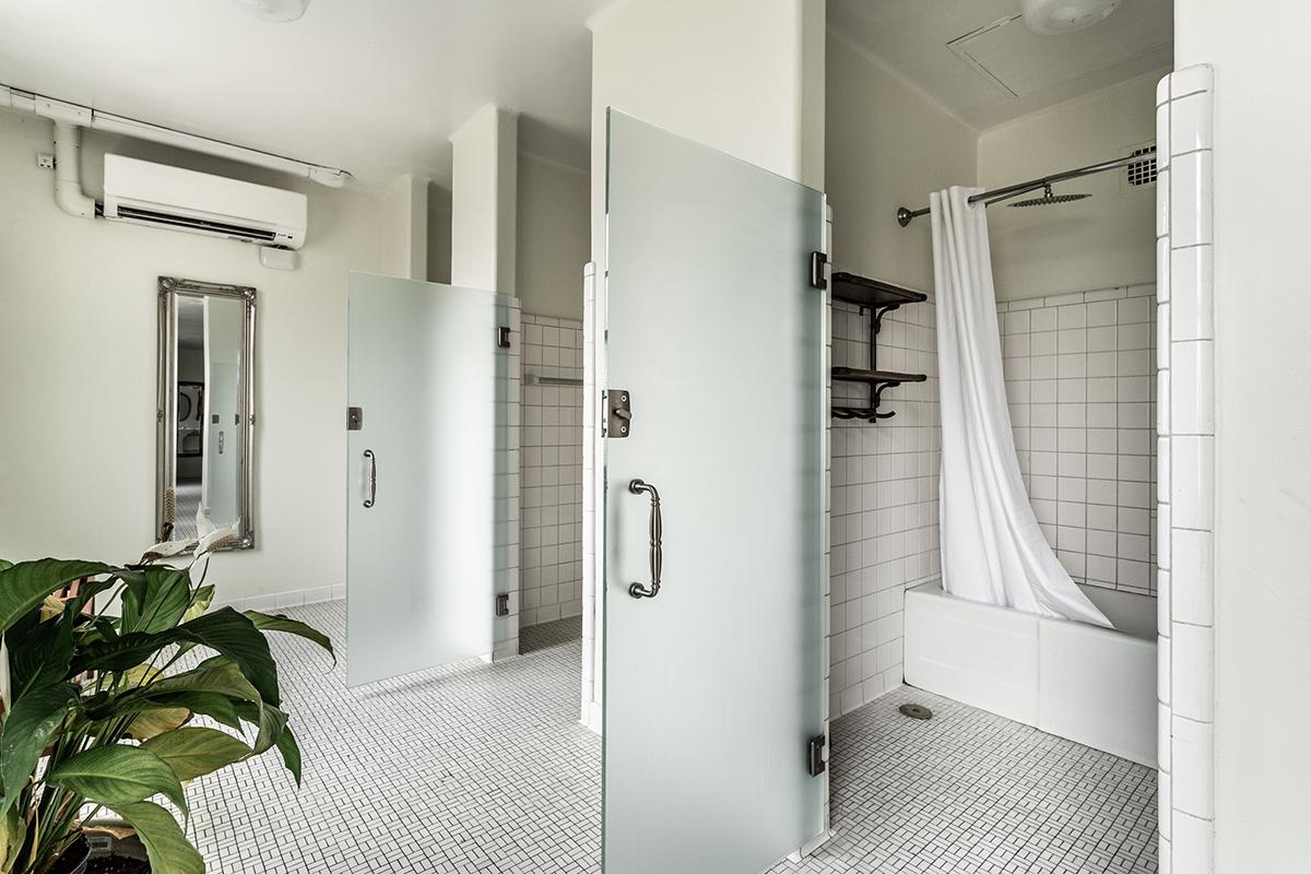 a room with a sink and a mirror