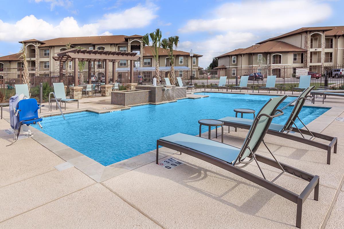 a house with a pool in front of a building