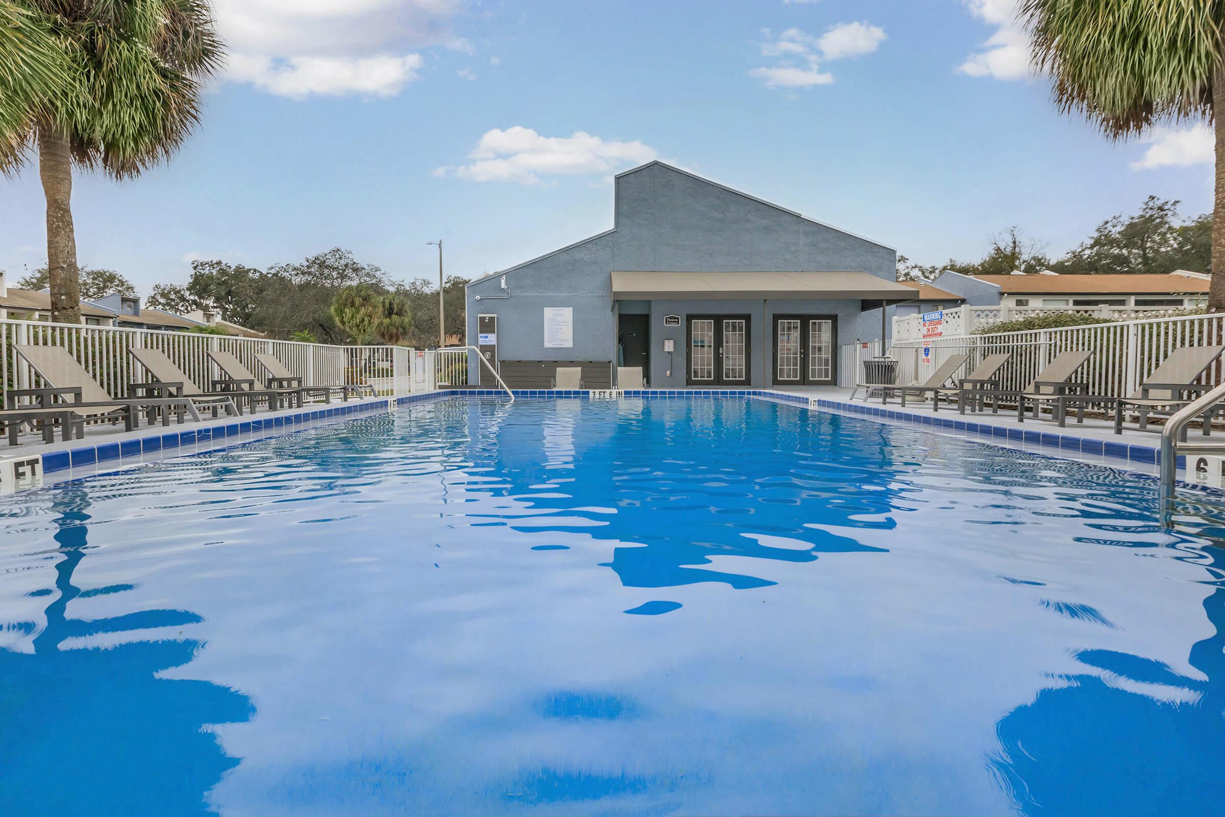 a pool next to a body of water