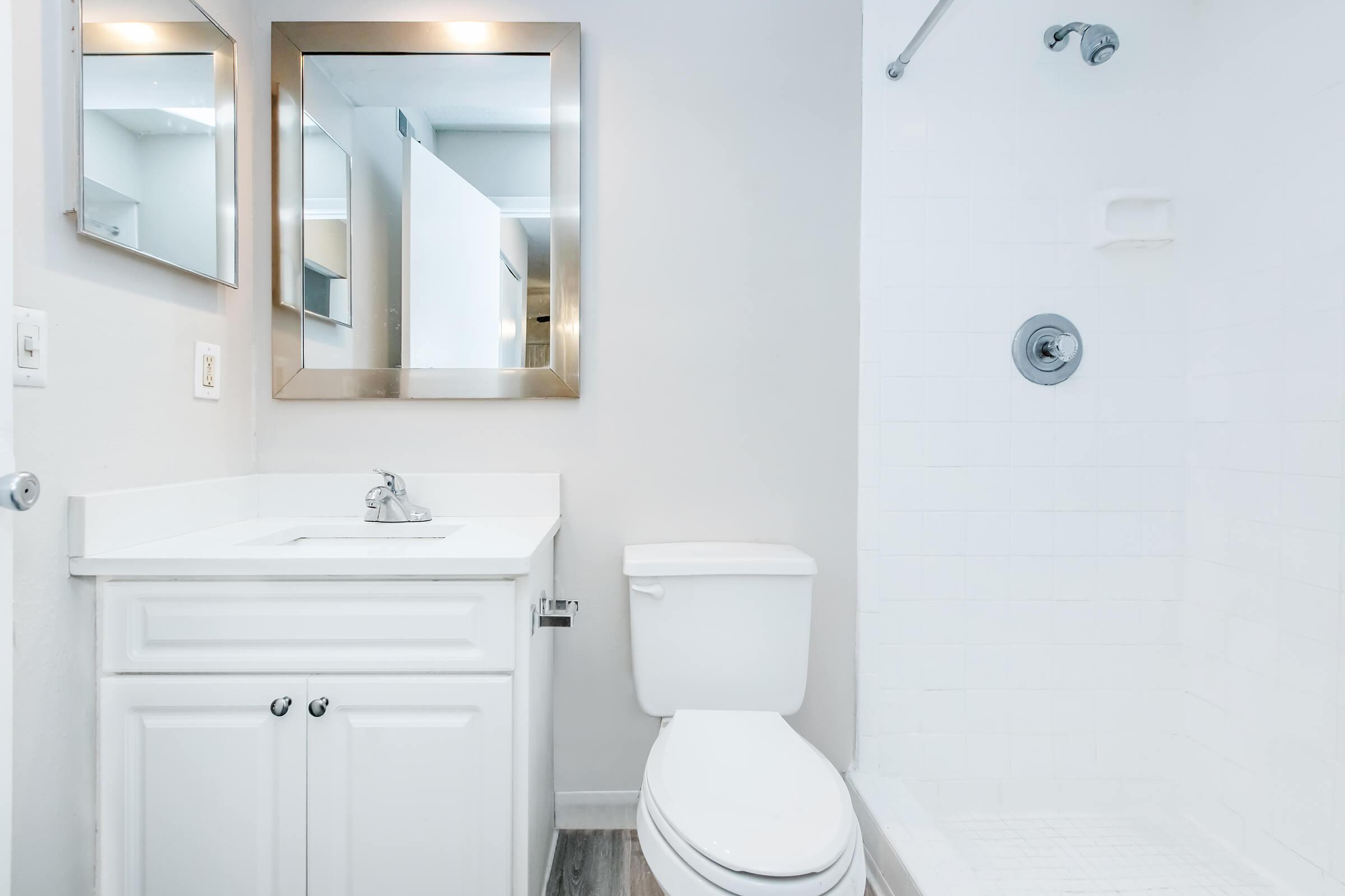 a room with a sink and a mirror
