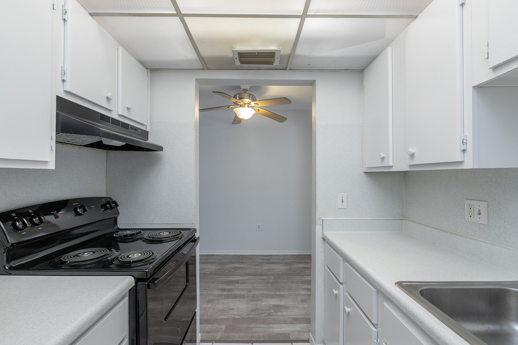 a kitchen with a stove and a sink
