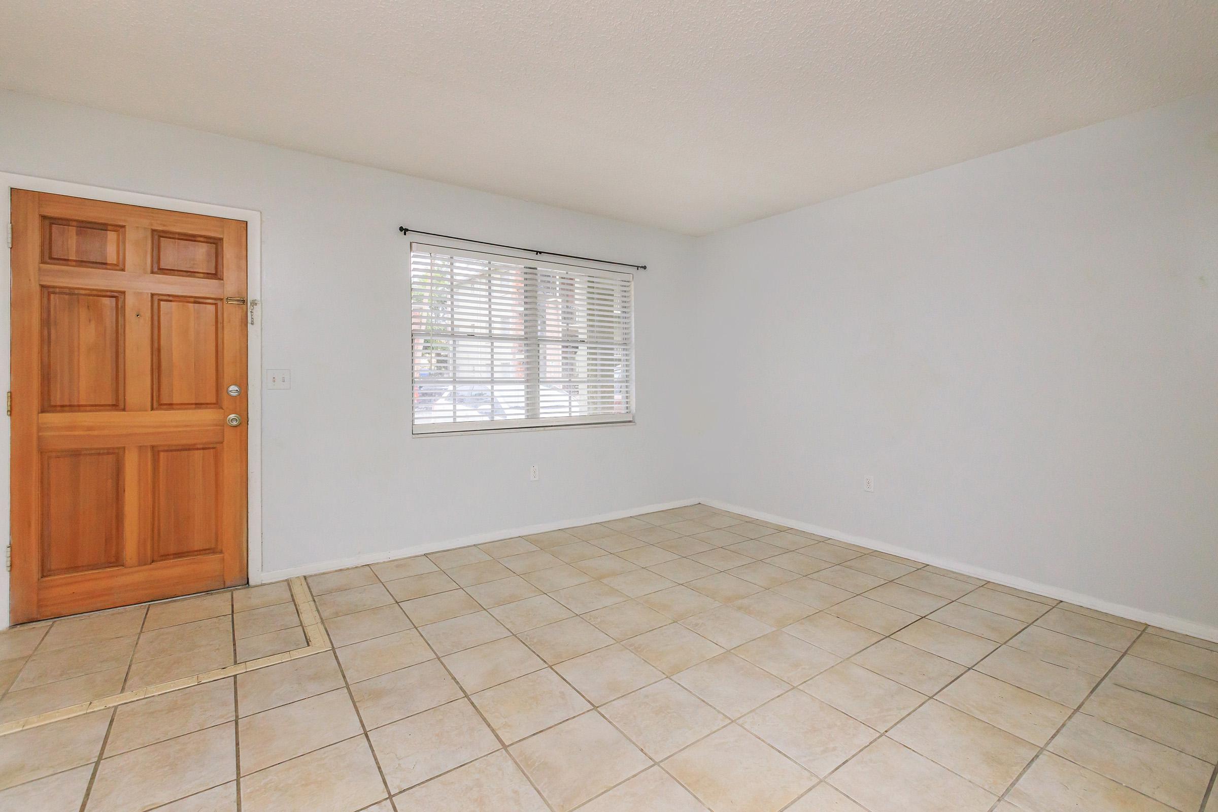 a kitchen with a tiled floor