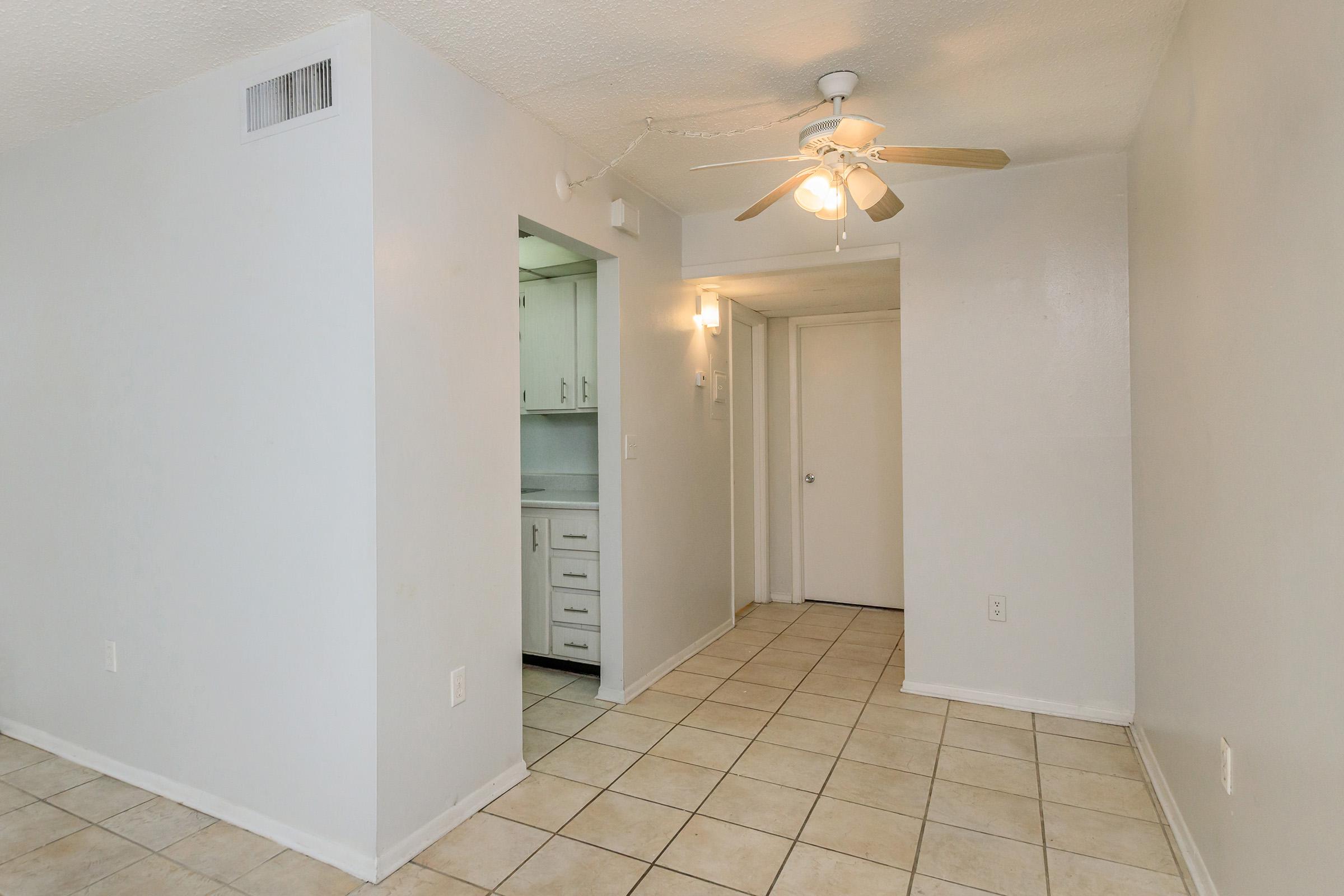 a kitchen with a sink and a refrigerator