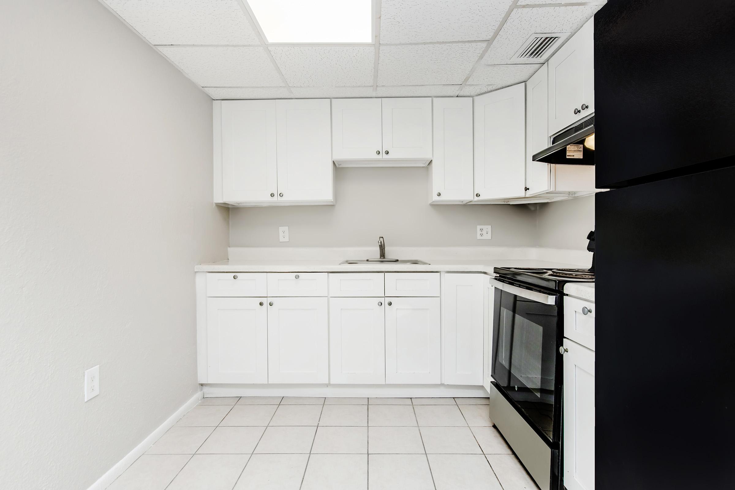 a kitchen with a stove and a refrigerator