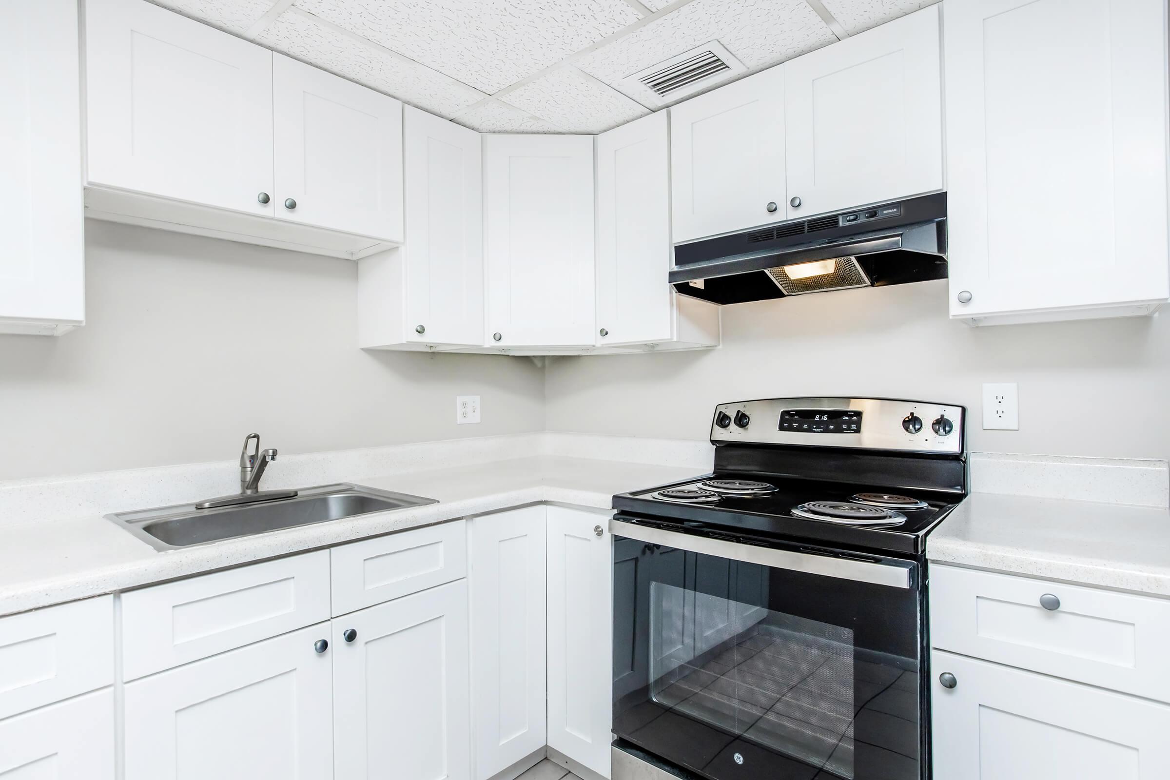 a kitchen with a stove top oven