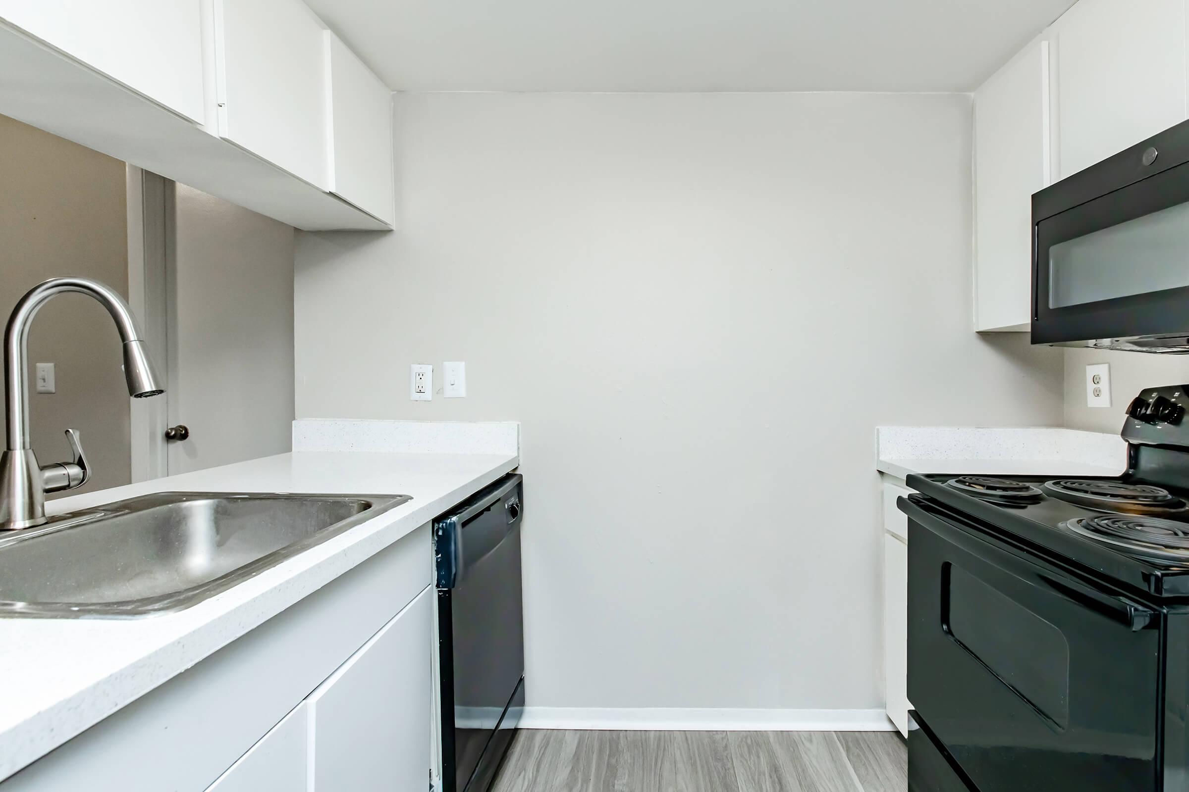 a kitchen with a stove and a sink