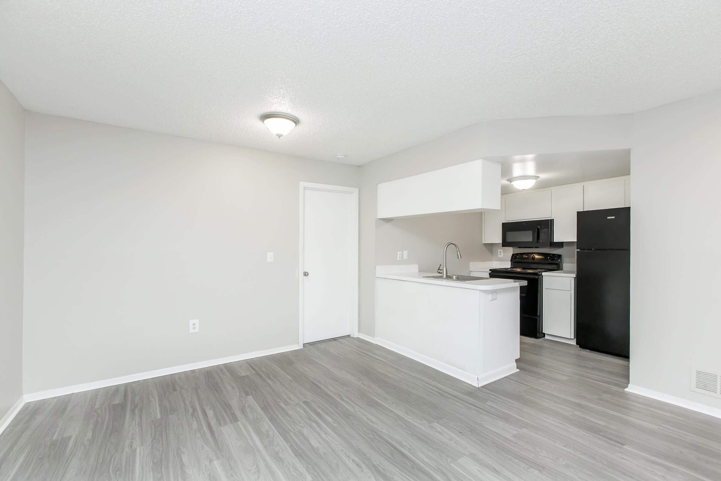 a kitchen with a wood floor