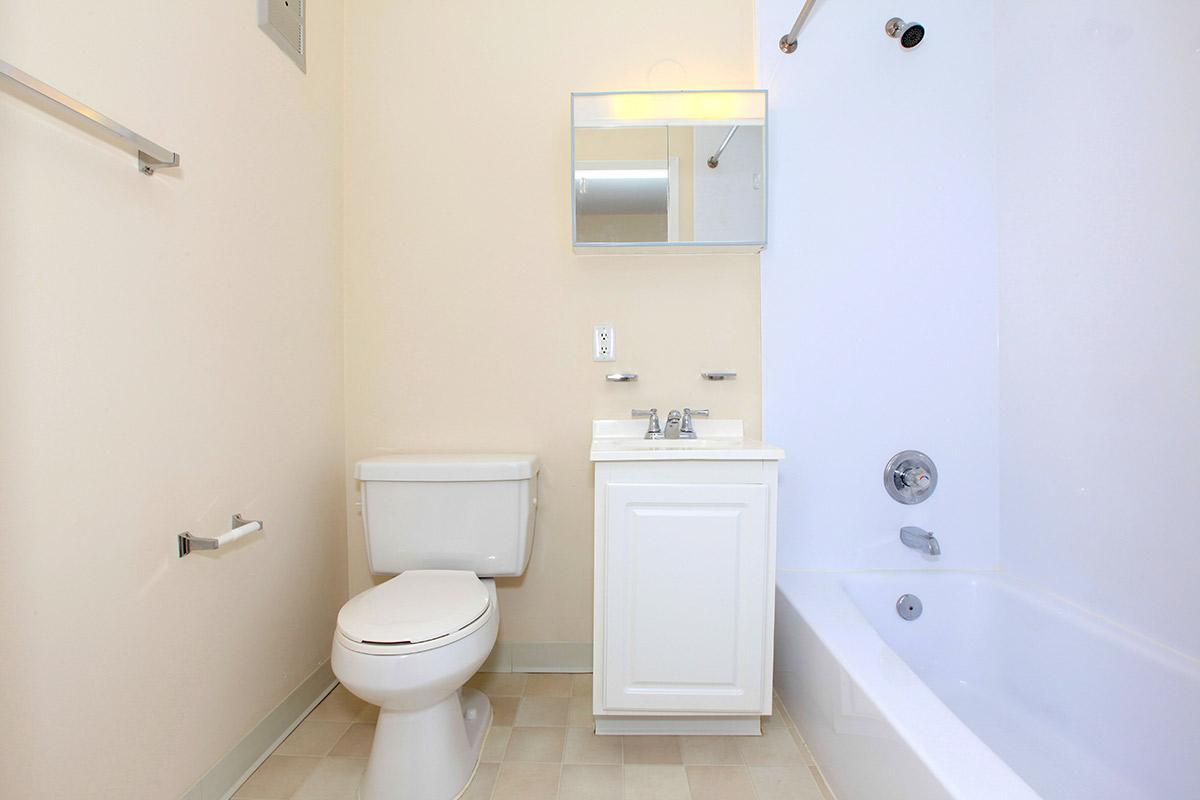 a small white sink in a bathroom