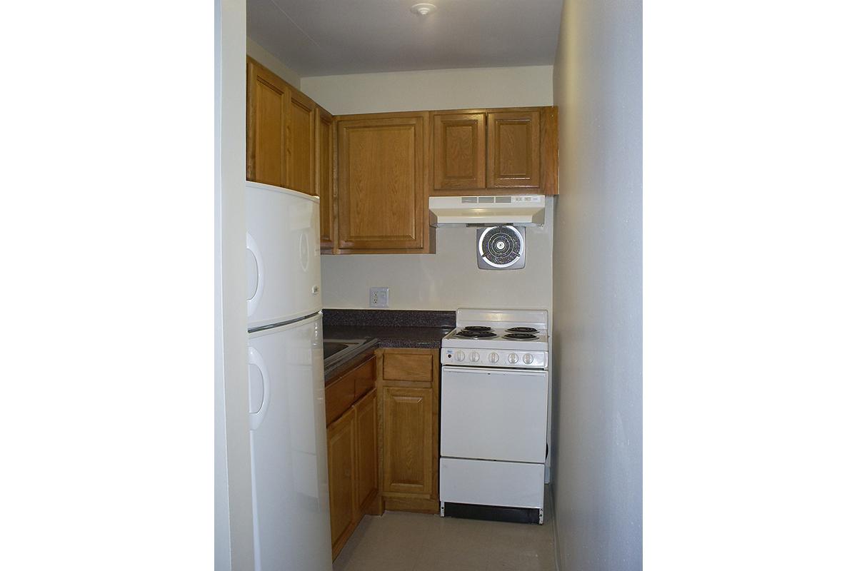 a white refrigerator freezer sitting inside of a kitchen
