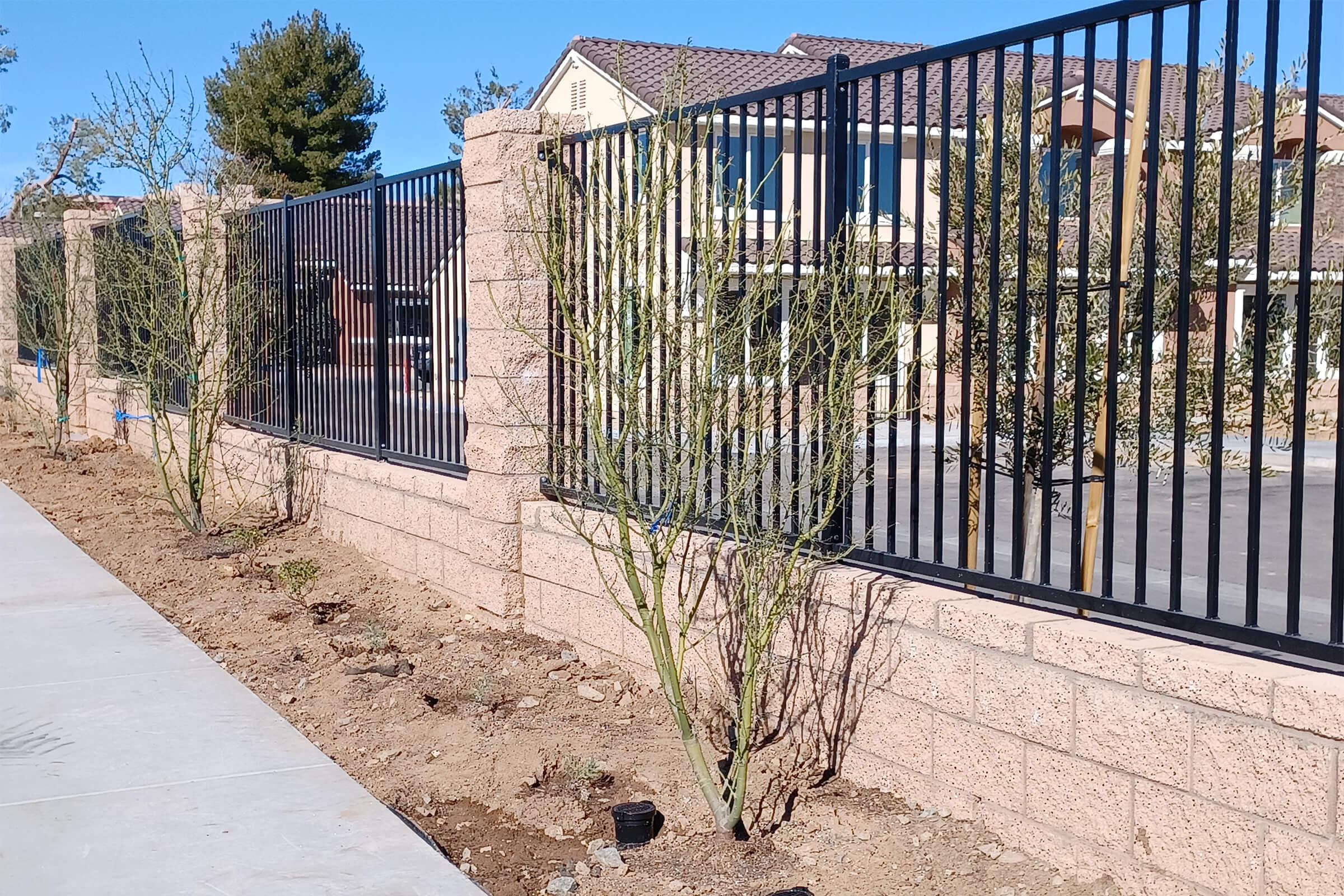 a gate in front of a fence