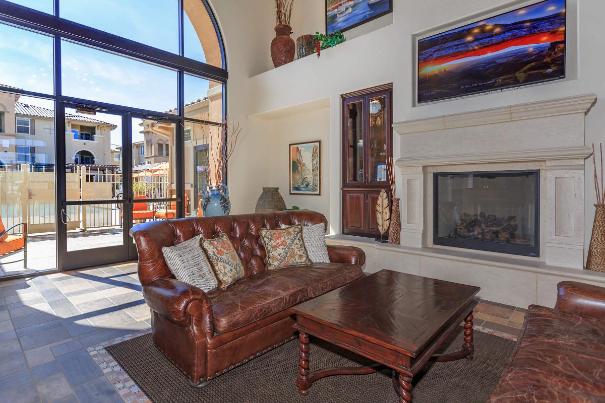 a living room filled with furniture and a fire place