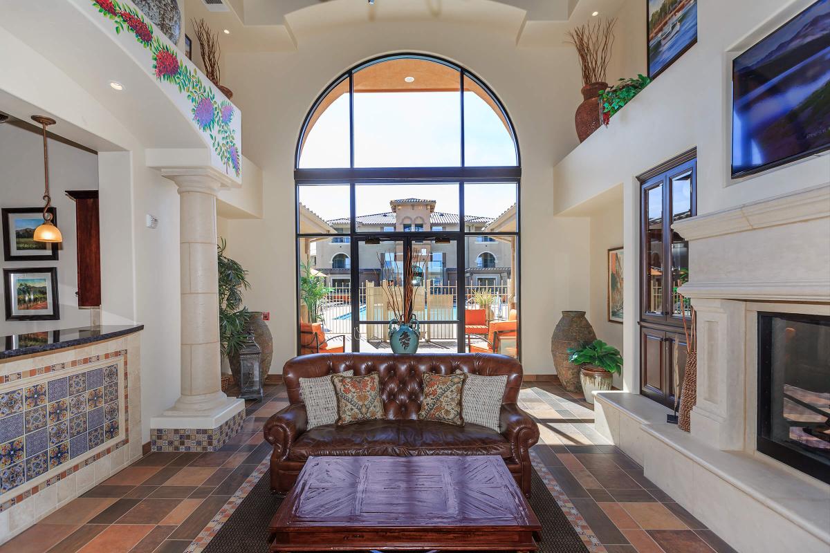 a living room filled with furniture and a fire place