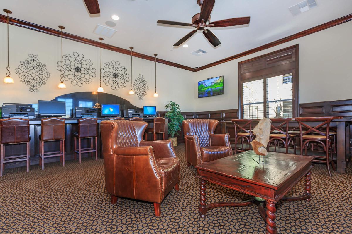 a living room filled with furniture and a large window