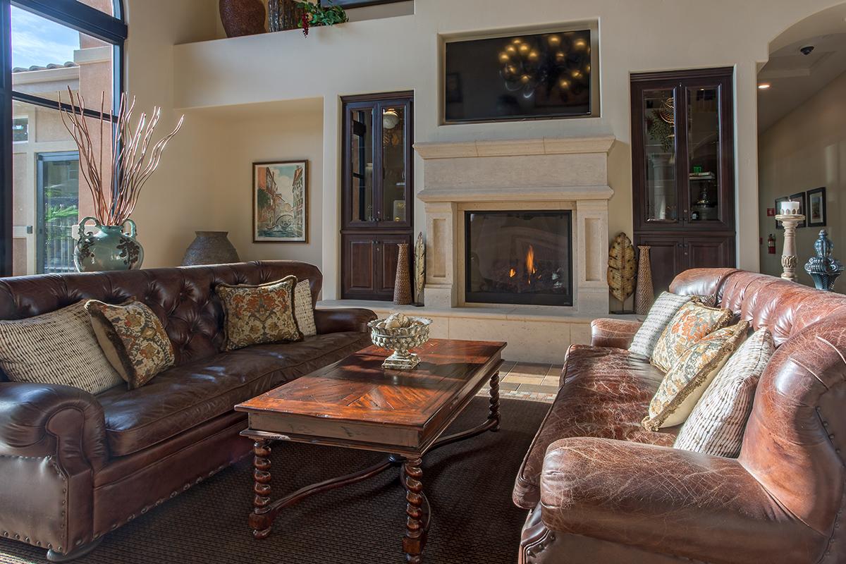 a living room filled with furniture and a fire place