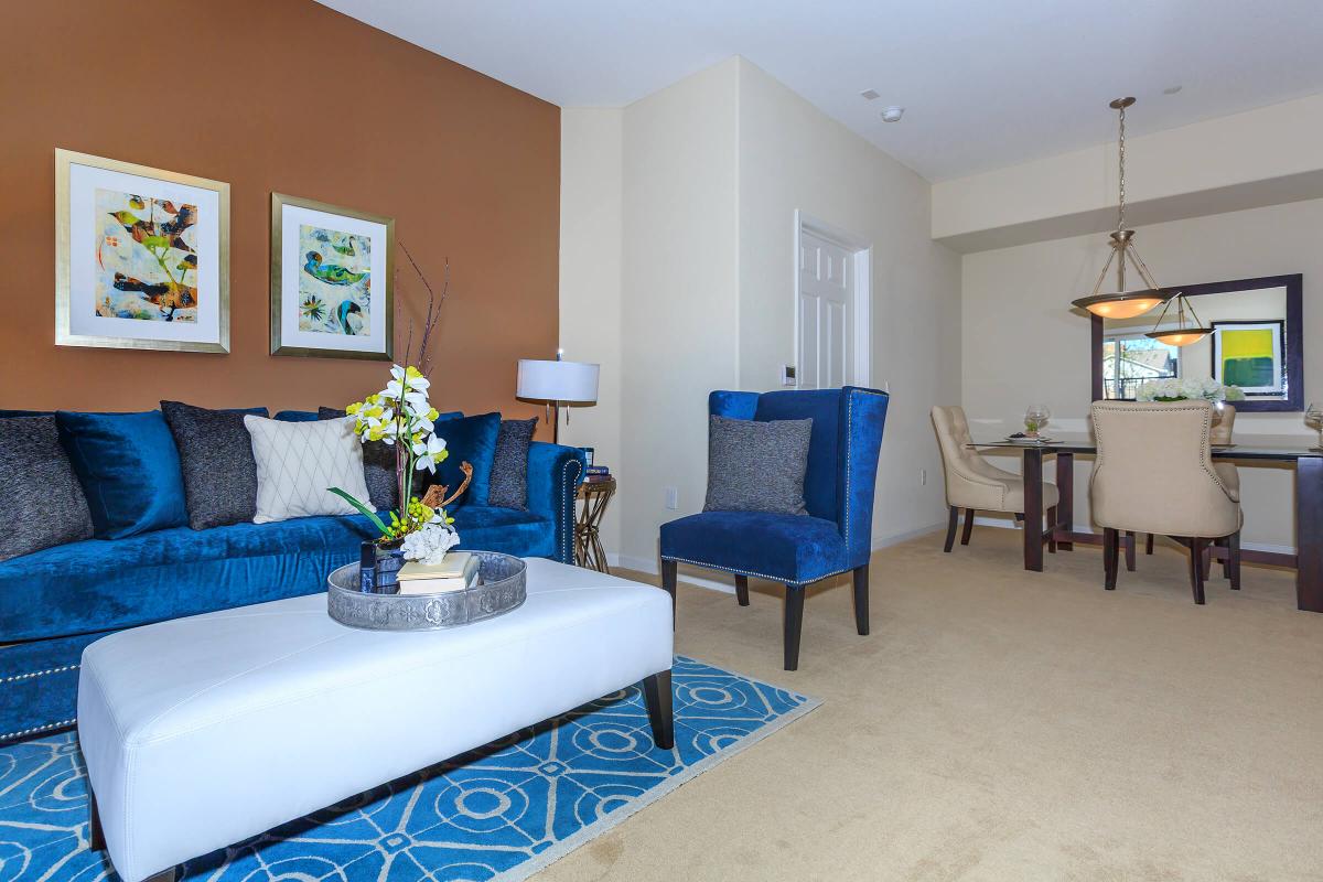 a living room with a blue chair