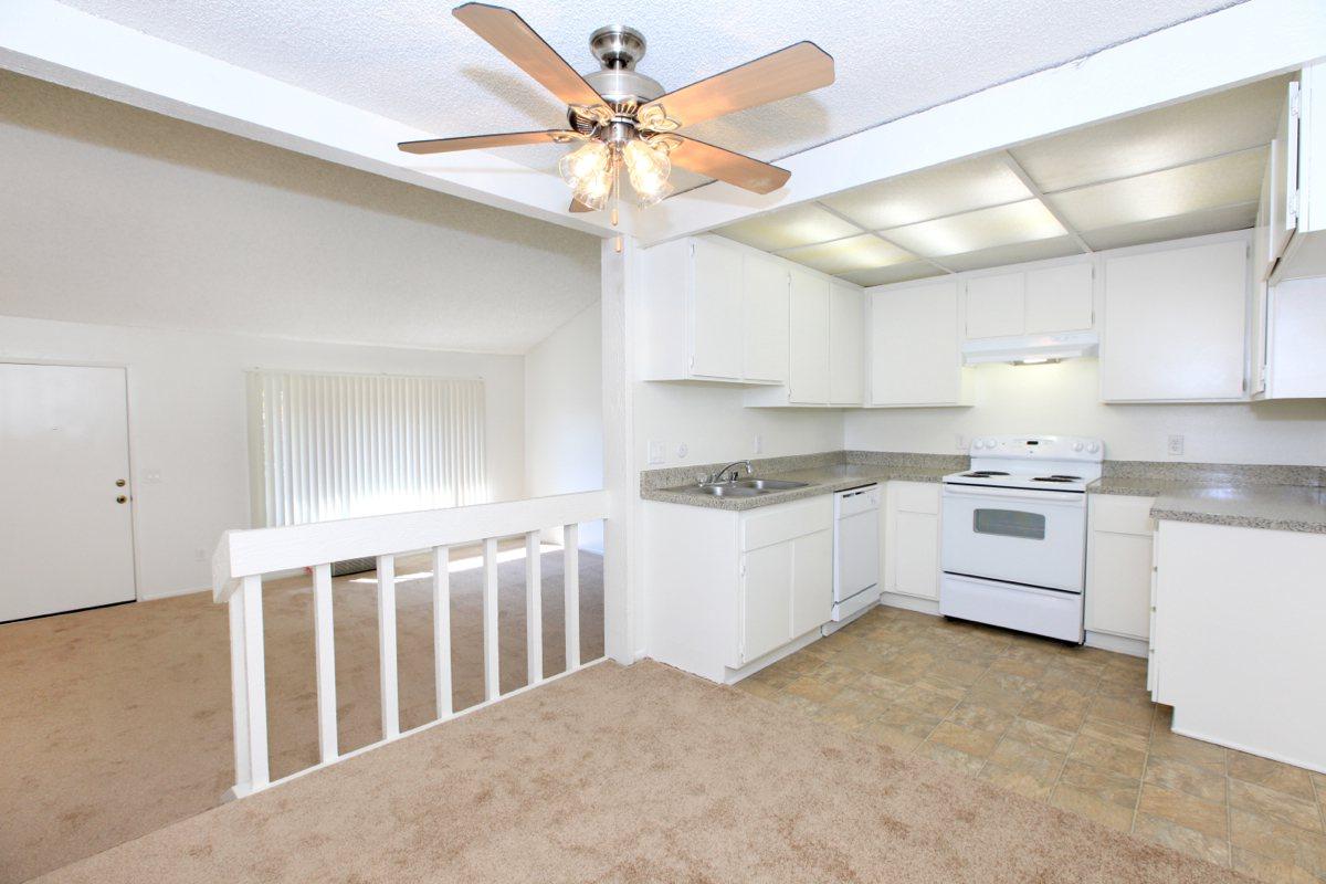 Carpeted dining room and living room