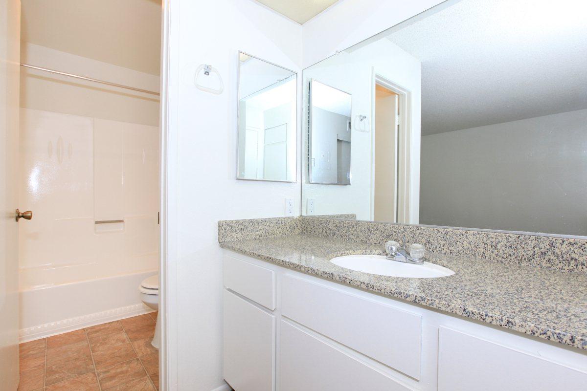 Bathroom with white cabinets