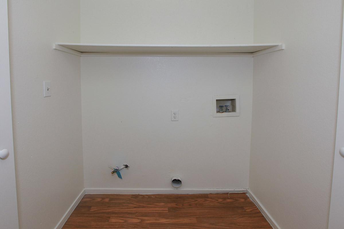 a white sink sitting next to a door