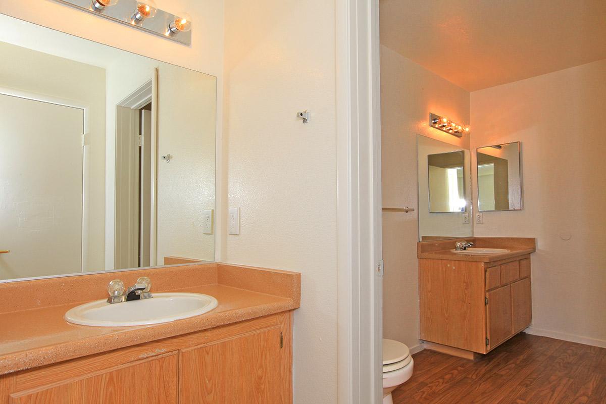 a room with a sink and a mirror