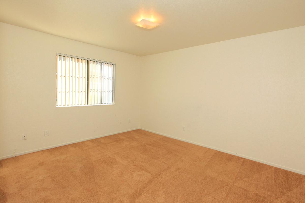 a bedroom with a bed in a room