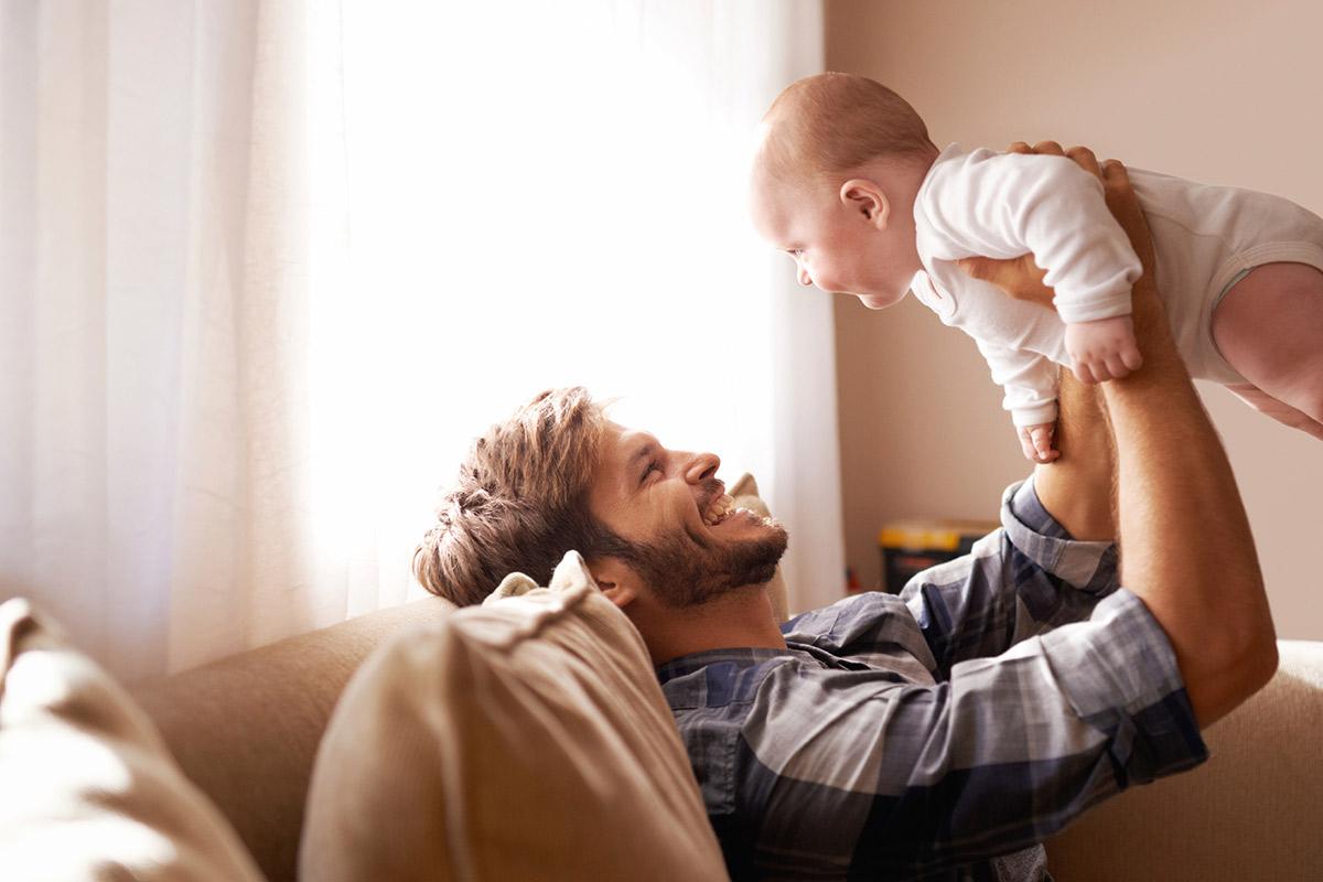 a man holding a baby