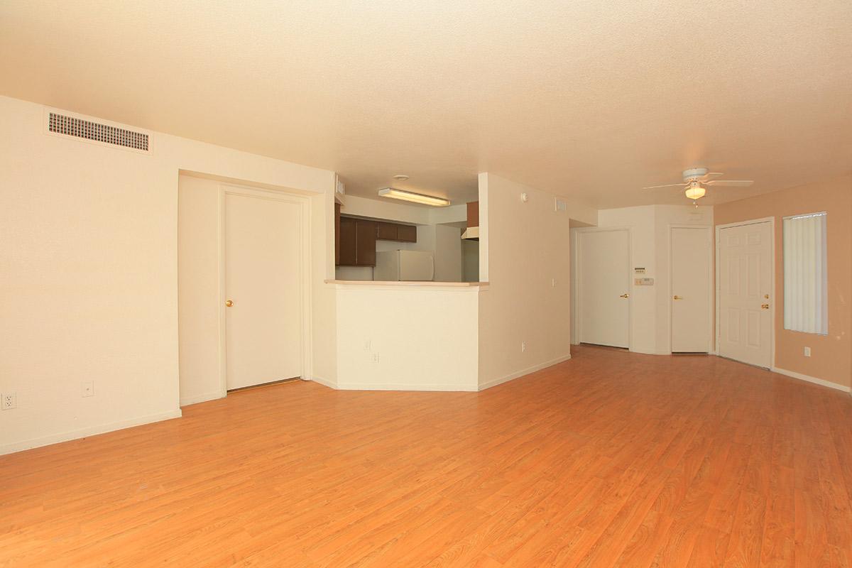 a large empty room with a wood floor