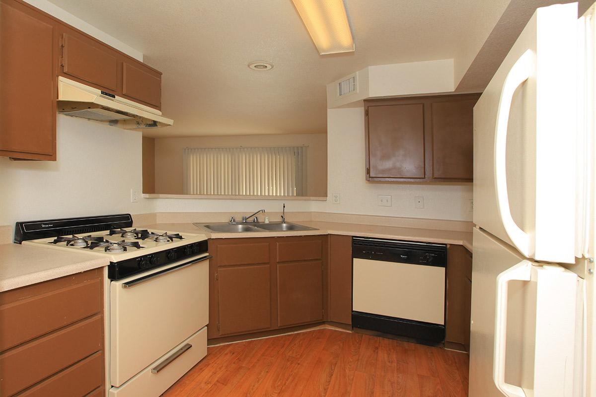 a kitchen with a stove top oven