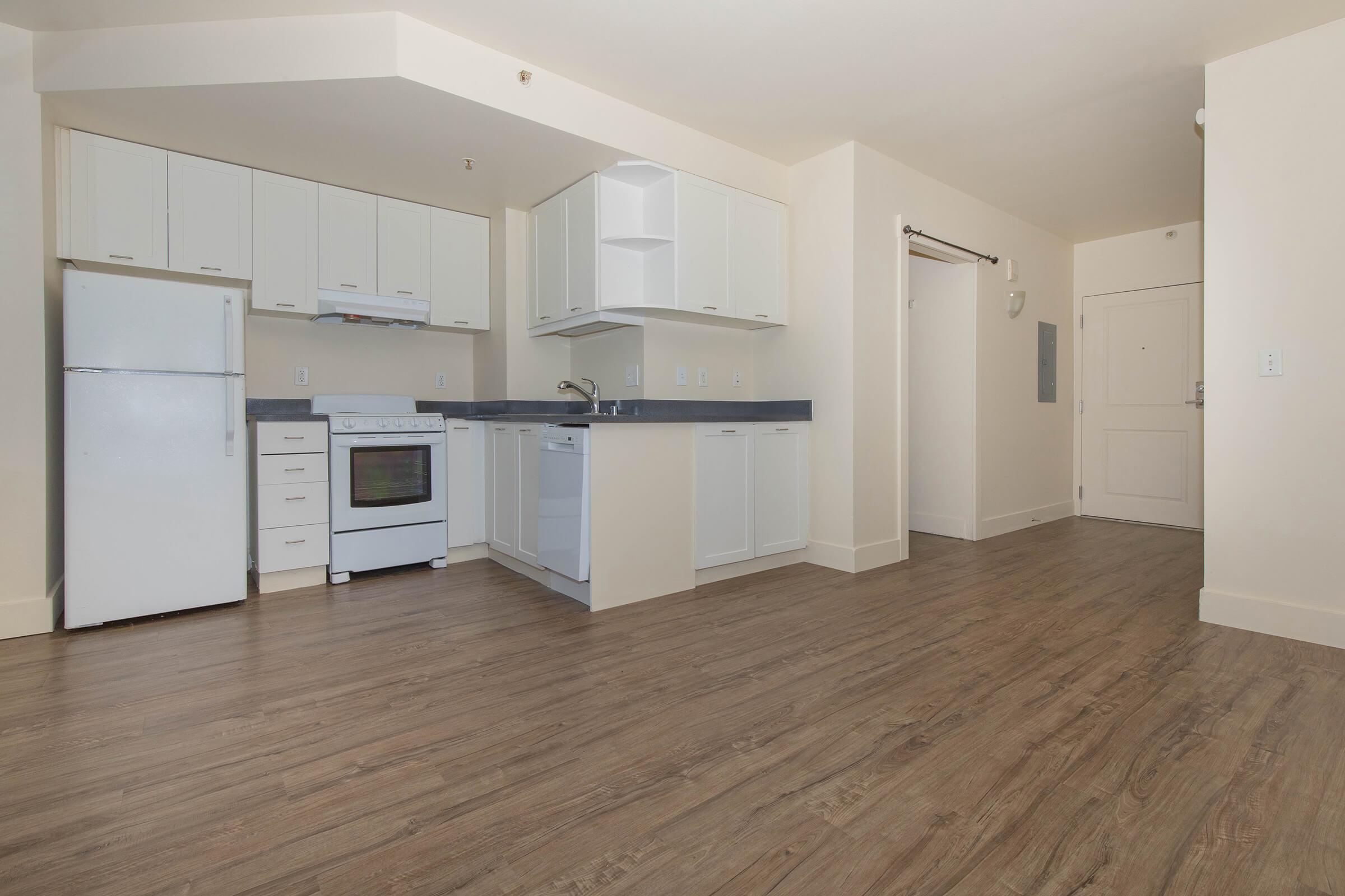 a kitchen with a building in the background