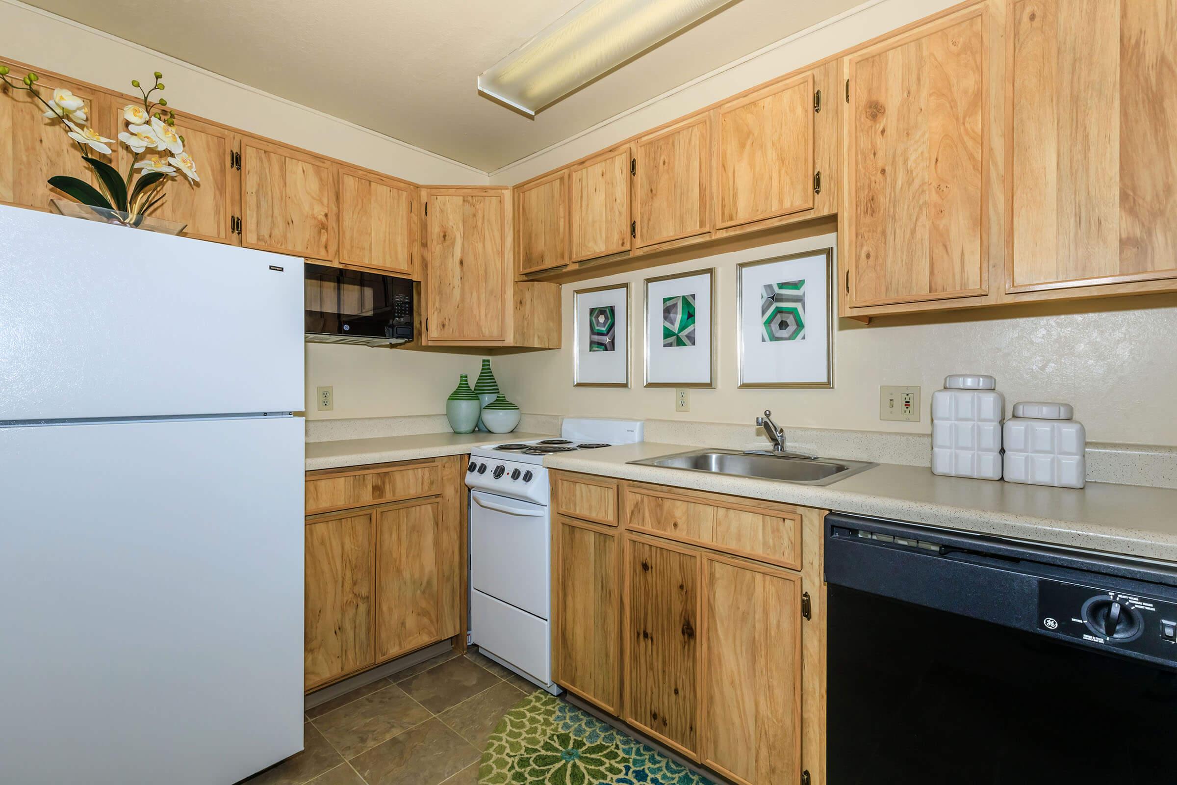 a kitchen with a stove and a refrigerator