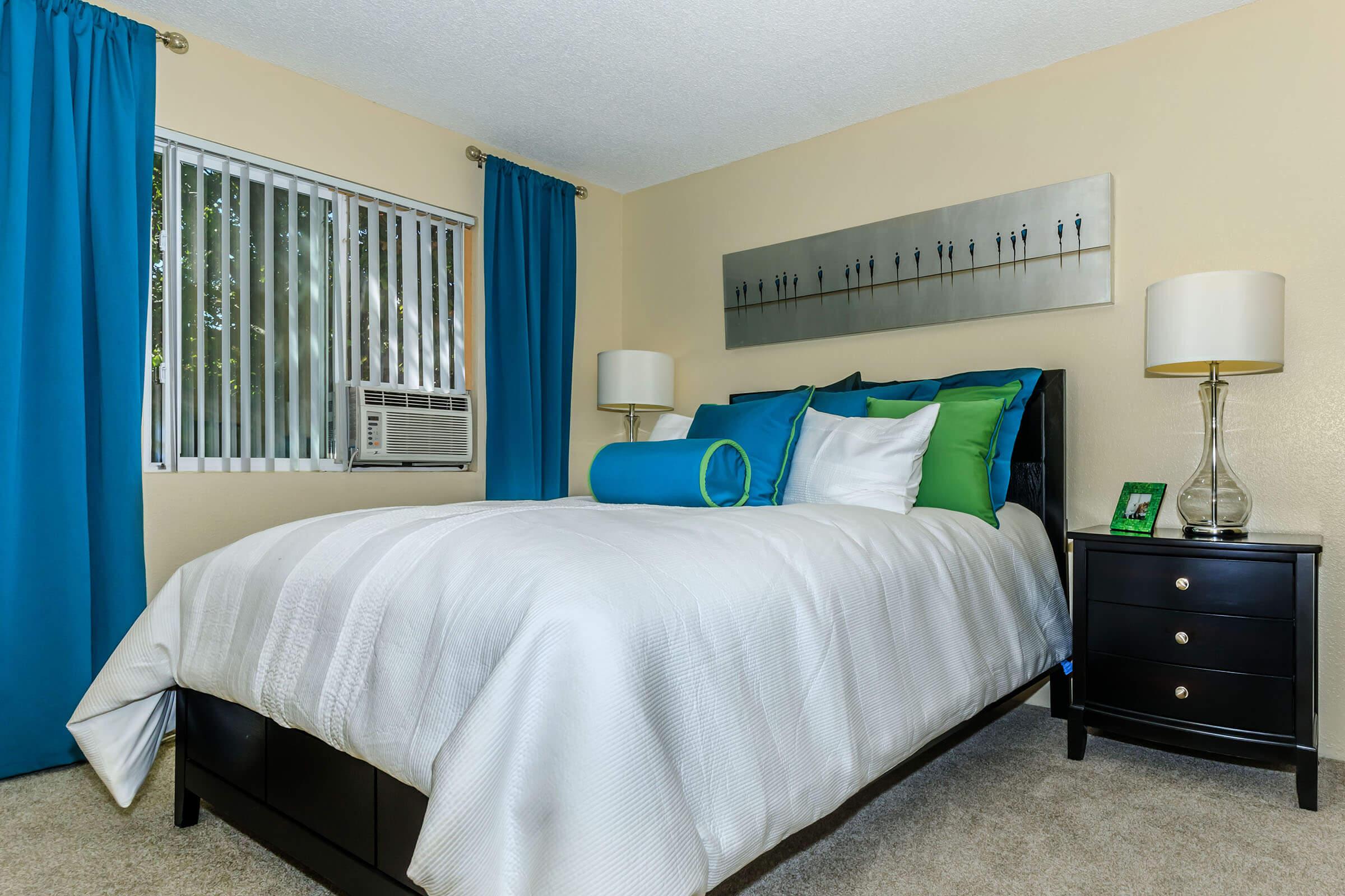 a bedroom with a large bed in a hotel room