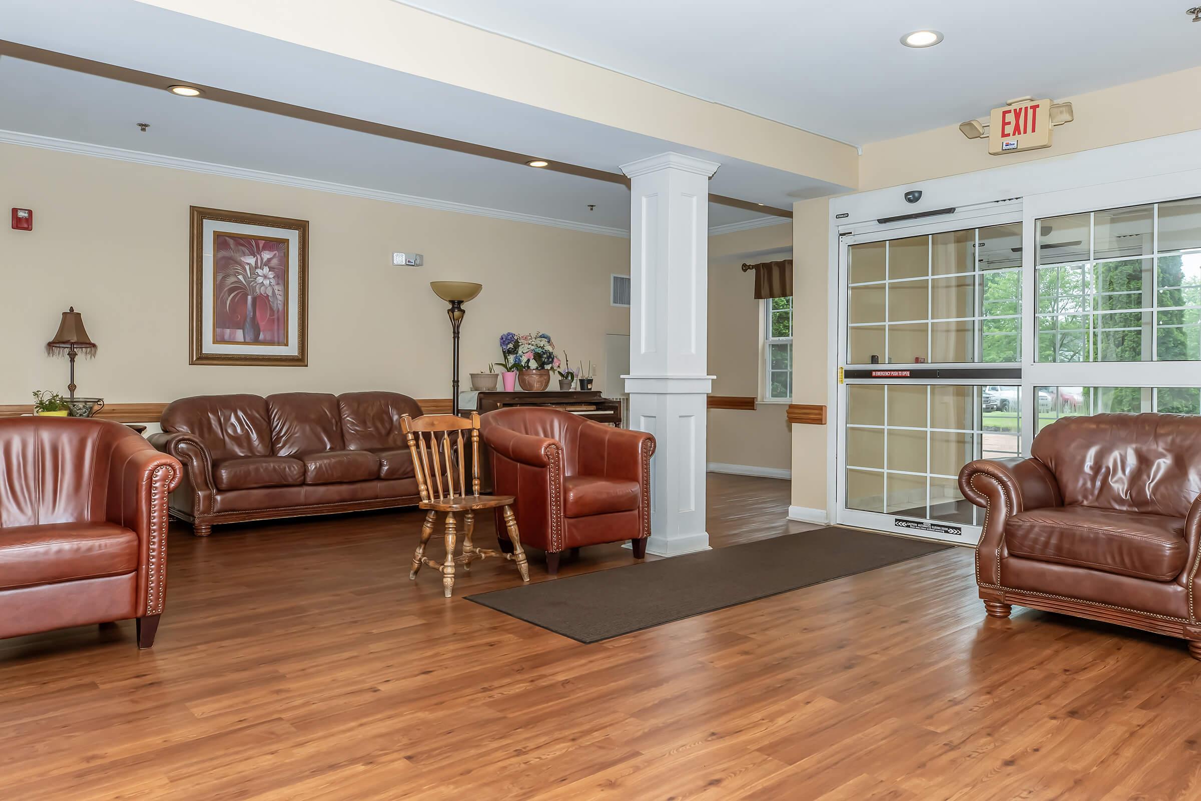 a living room filled with furniture and a fireplace