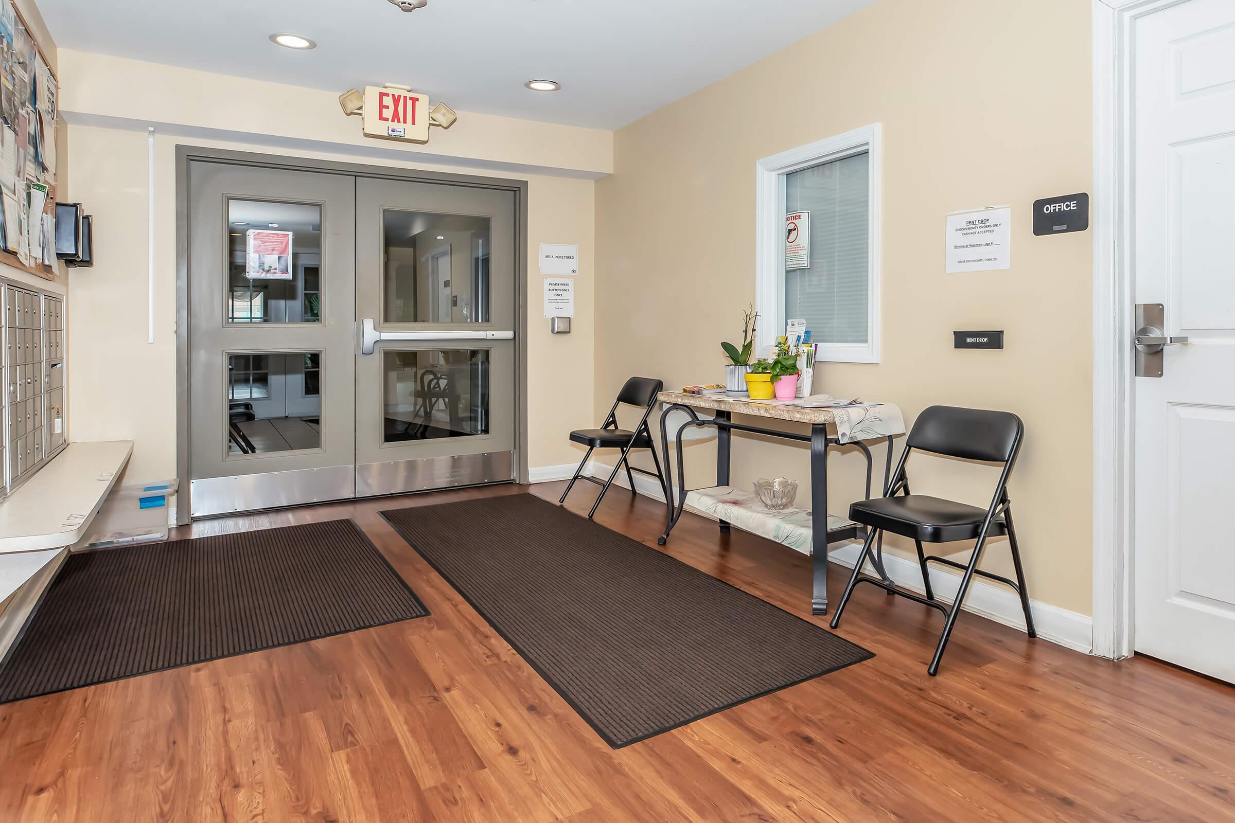 a living area with wooden wheels in a room