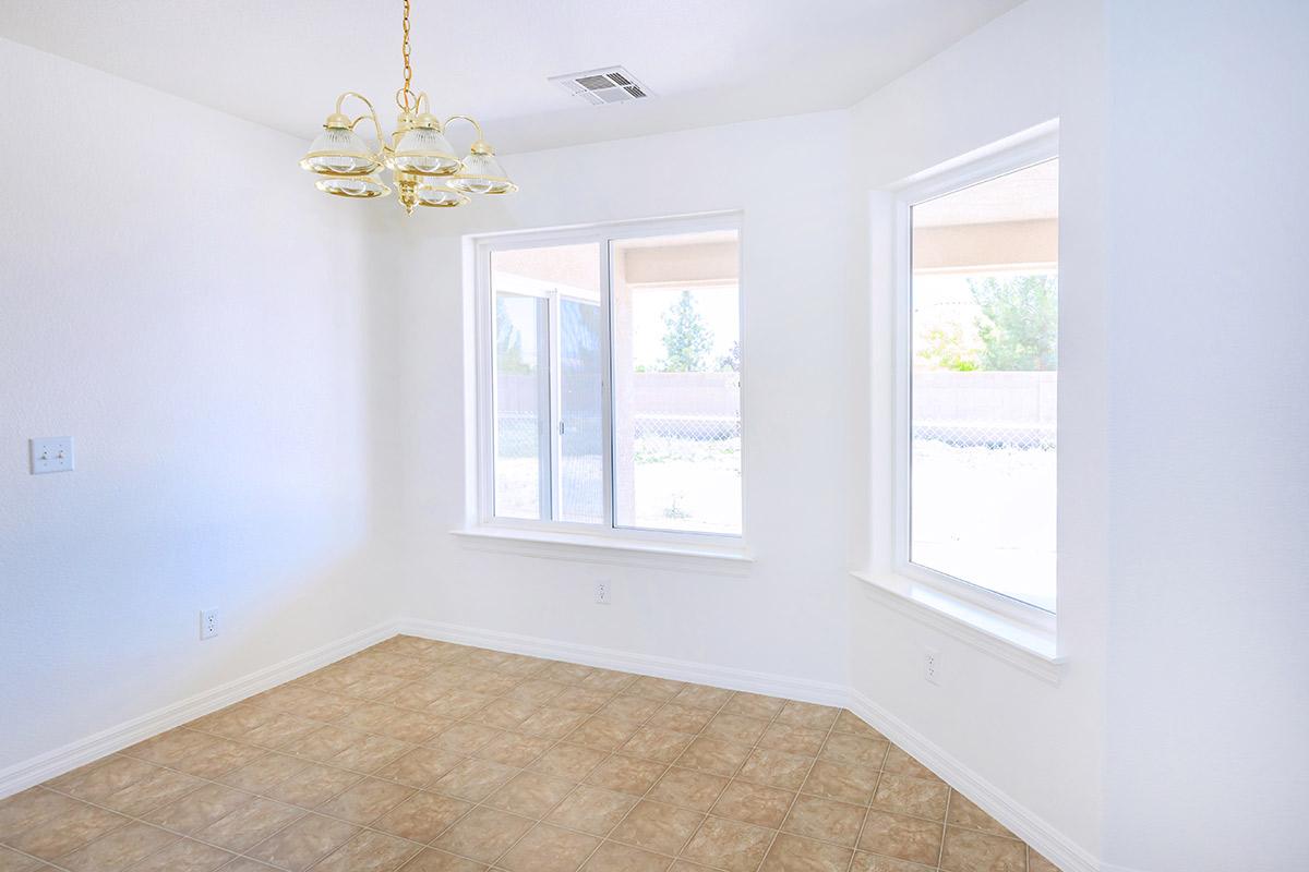 a white sink sitting under a window