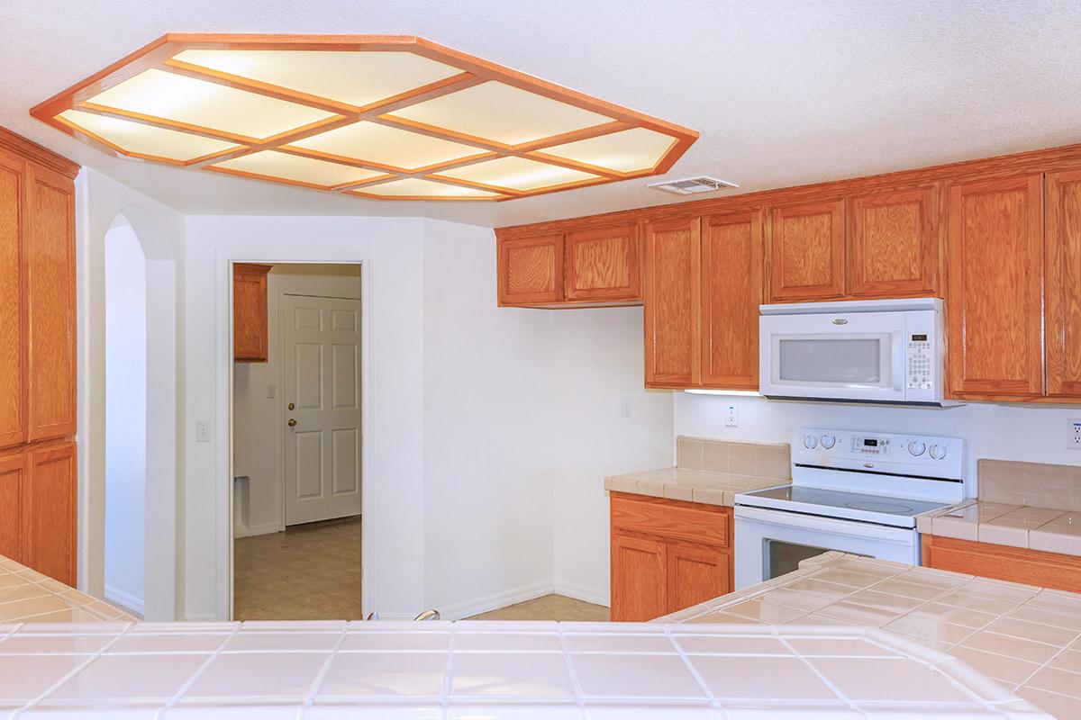 a kitchen with a stove and a refrigerator